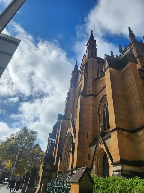 The grand Gothic spires of St. Mary's Cathedral against a blue sky.
