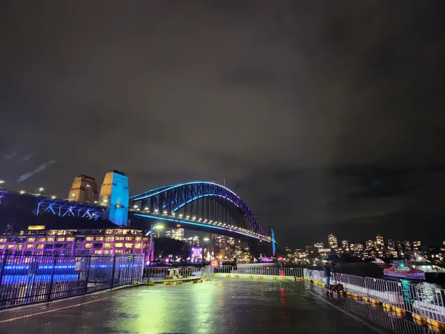 The Sydney Harbour Bridge illuminated in blue for Vivid Sydney.