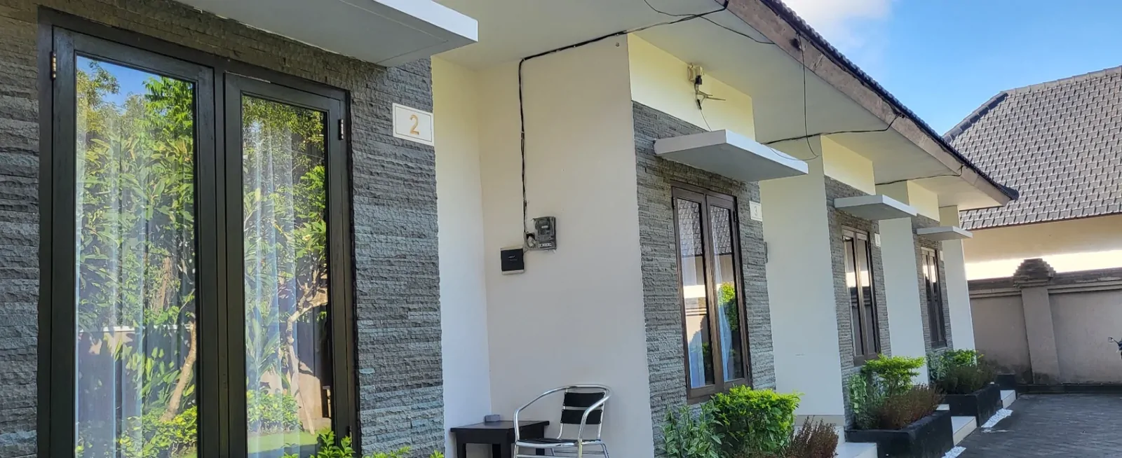 The white walls and stone panels of my guesthouse terrace.
