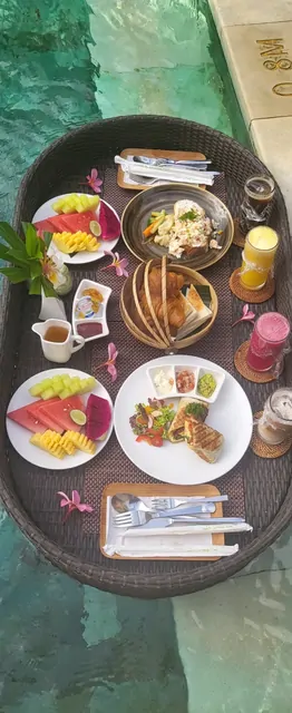 A colorful floating brunch tray in the resort pool.