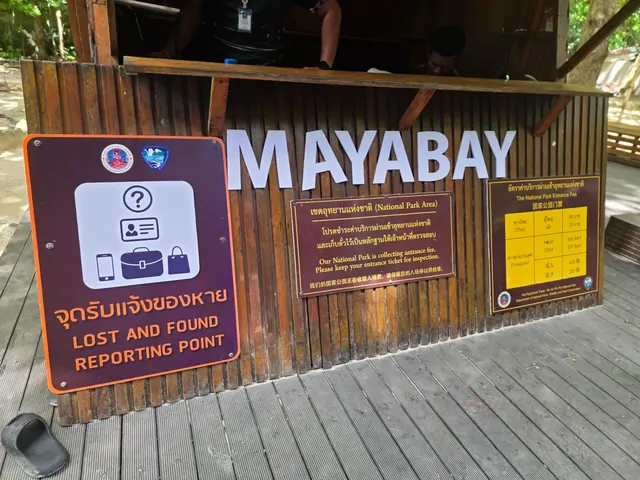The entrance sign and lost and found board at Maya Bay National Park.