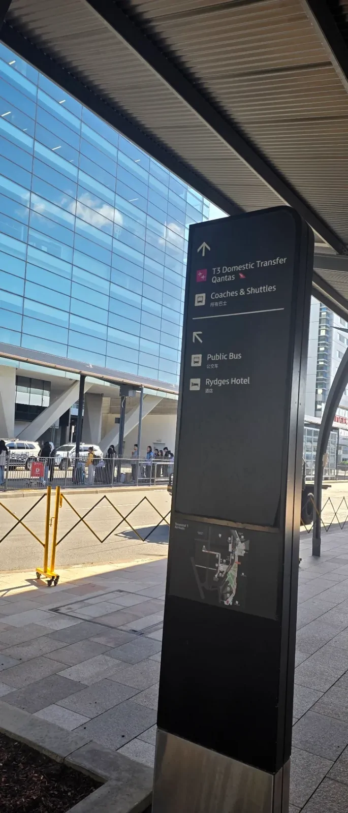 Modern airport signage and glass architecture upon arrival.