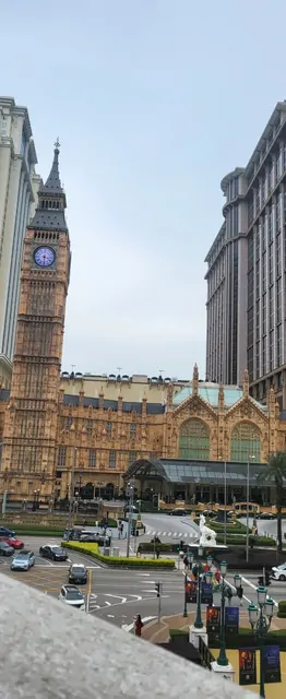 A city street featuring a Big Ben replica and European-style buildings.