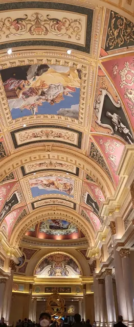 Golden decorations and Baroque ceiling frescoes inside the Venetian hotel.