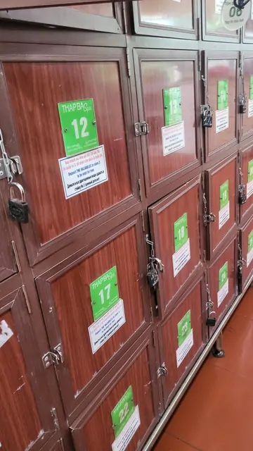 Numbered storage lockers in a brown wooden facility.
