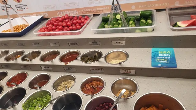 The extensive self-service sauce and vegetable bar at Haidilao.