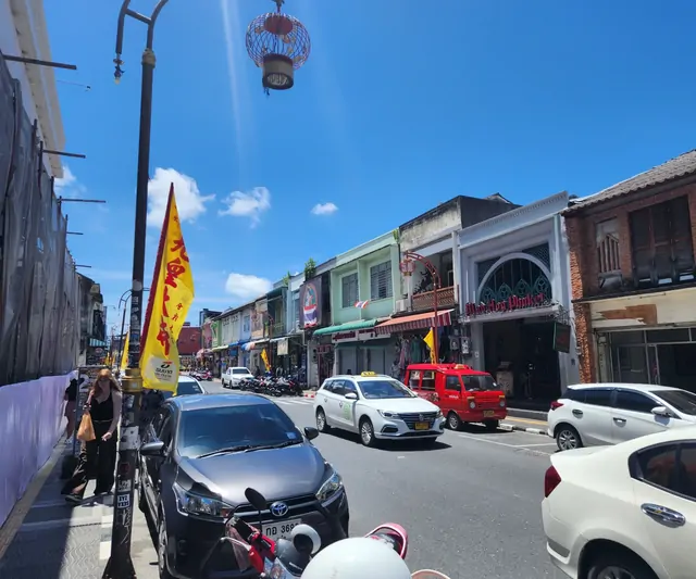 The lively daytime atmosphere of the streets in Phuket Old Town.