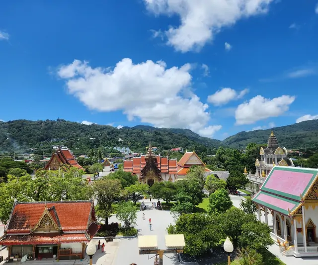 An aerial view of the Wat Chalong temple complex and tropical greenery.
