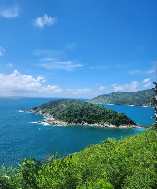 Emerald waters and green islands seen from a Phuket viewpoint.